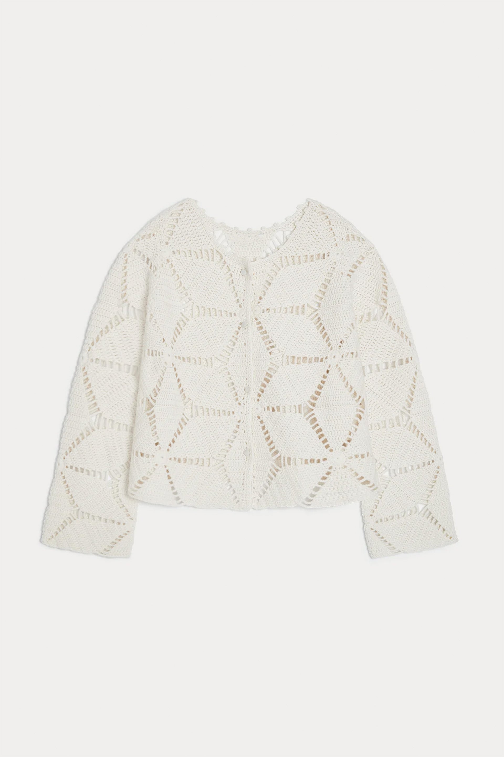 White knit sweater with geometric pattern on a white background